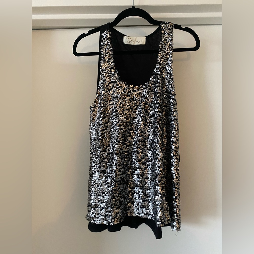 Sliver sequin and black racer back tank top.